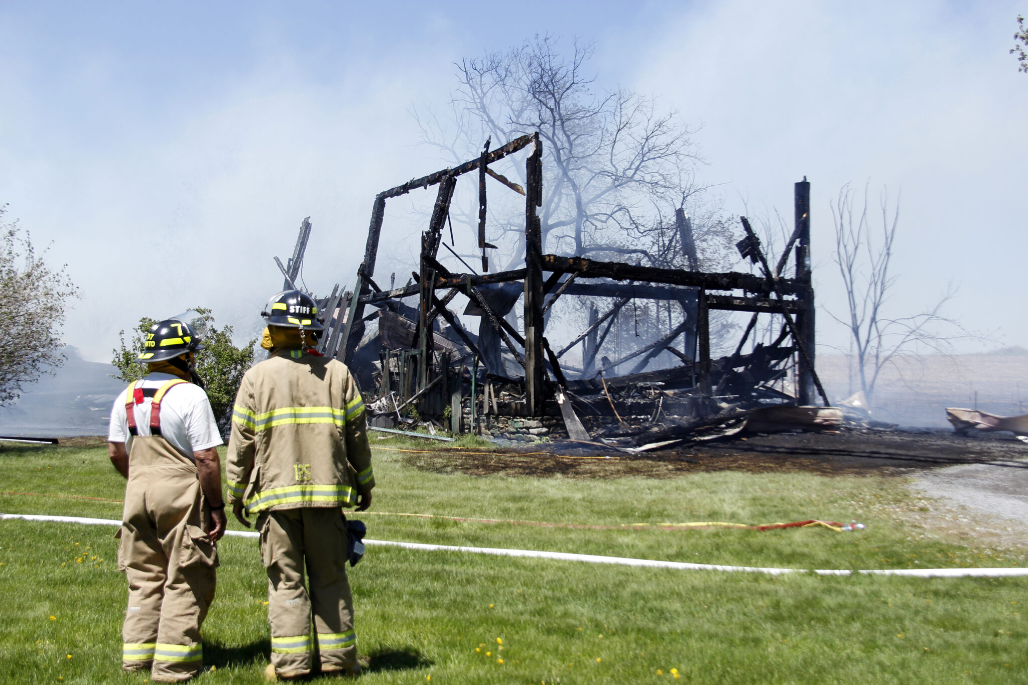 <p>Local Firefighters at the scene of a three structure fire in May, 2021. (Desirée Decoste/Gazette File Photo)</p>

