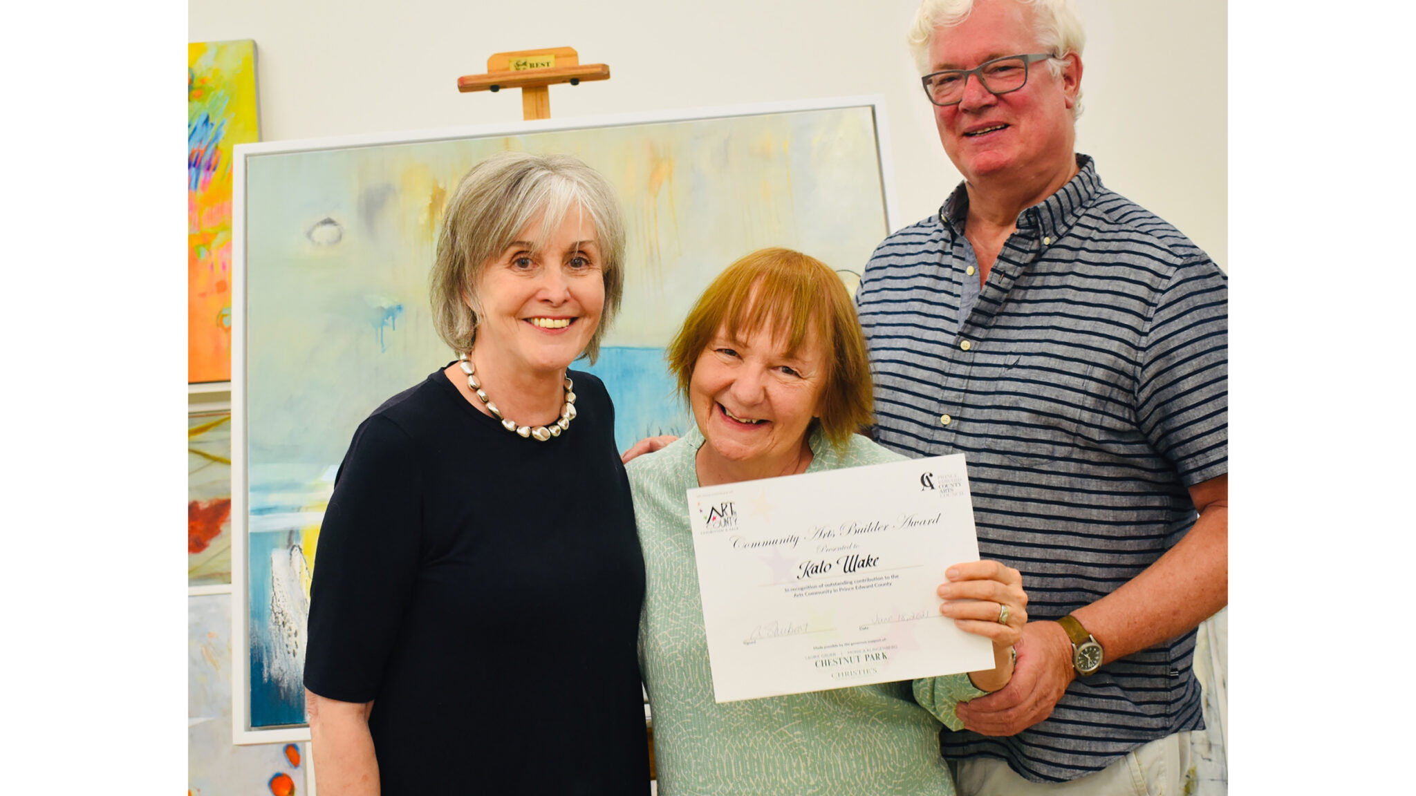<p>(Left) Monica Klingenberg and (right) Laurie Gruer stand with Kato Wake, the 2021 recipient of the Community Arts Builder Award presented by the Prince Edward County Arts Council and Art in the County. (Submitted photo)</p>

