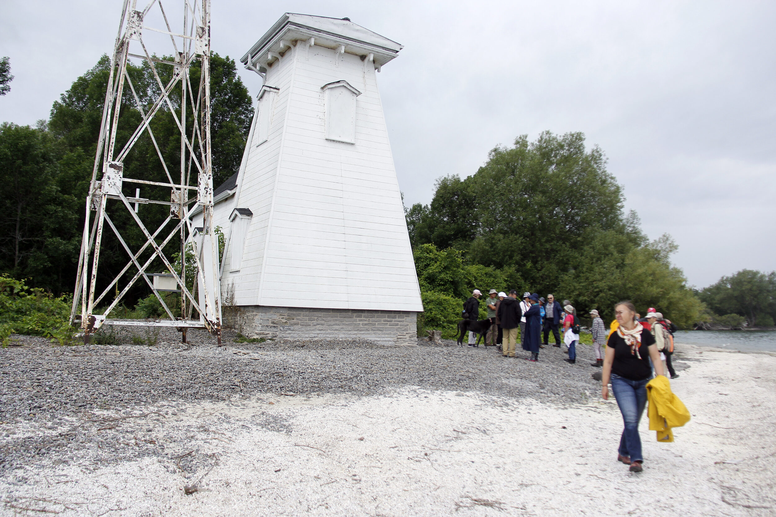 <p>LIGHTHOUSE HISTORY A group of people gathered close to listen to local historian Marc Seguin tell some of the history of the Point Traverse Lighthouse/Prince Edward Point Lighthouse on July 18. The walk was organized by the South Shore Joint Initiative (SSJI).(Desirée Decoste/Gazette staff)</p>
