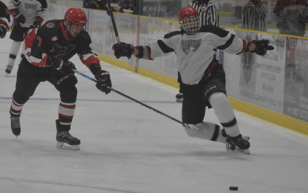 <p>Picton Pirate Reese Hancock spills Napanee Raider Ethan Broek into the boards with a check during an exhibition game at Lehigh Arena on Sunday afternoon. The late summer tune up was the first junior junior hockey game with fans since March 12, 2020. (Gazette Staff)</p>

