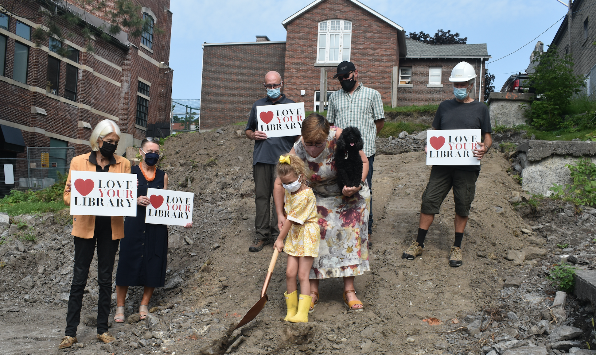 <p>Dahlia Donovan gets a helping hand from Love your Library Fundraising Chair Alexandra Bake and Chico as (From left) Library Chair Devon Jones, PEC Head Librarian Barb Sweet, Peter Knudsen of K Knudsen, Site supervisor Joe Andrus and architect Brian Clark watch Friday’s ceremonial ground breaking at the site of the Picton Library Expansion. (Jason Parks/Gazette Staff)</p>
