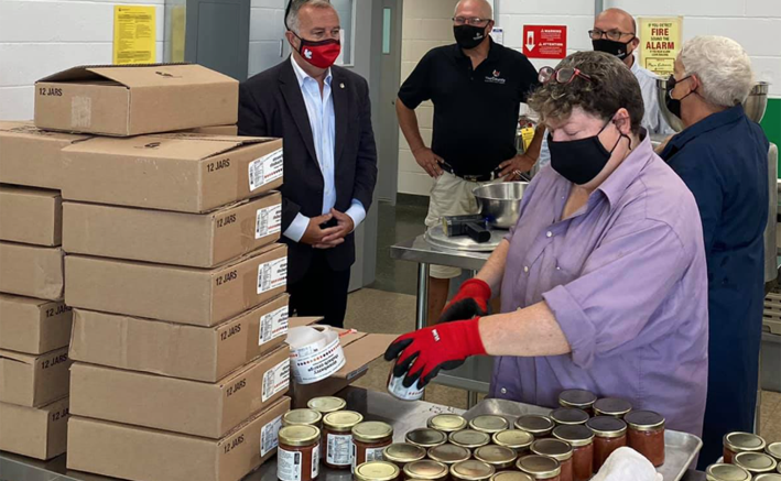 <p>AT THE HUB OF IT ALL County Fare members show off their labeling process for (From Left) Neil Ellis, Phil St. Jean and Steve Ferguson  at the County Food Hub Friday.  (Submitted Photo)</p>
