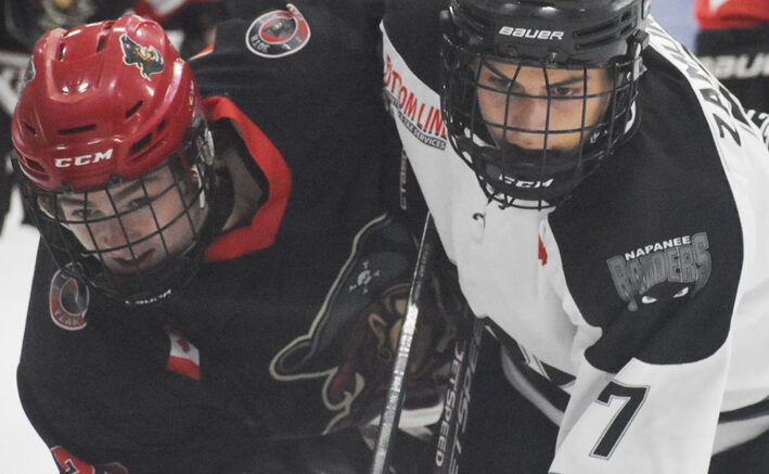 <p>FOREVER RIVALS Picton’s Landon MacLellan and Napanee’s Soren Zamuner battle off the draw during the Raiders’ 2-1 overtime win Friday.  (Gazette Staff)</p>

