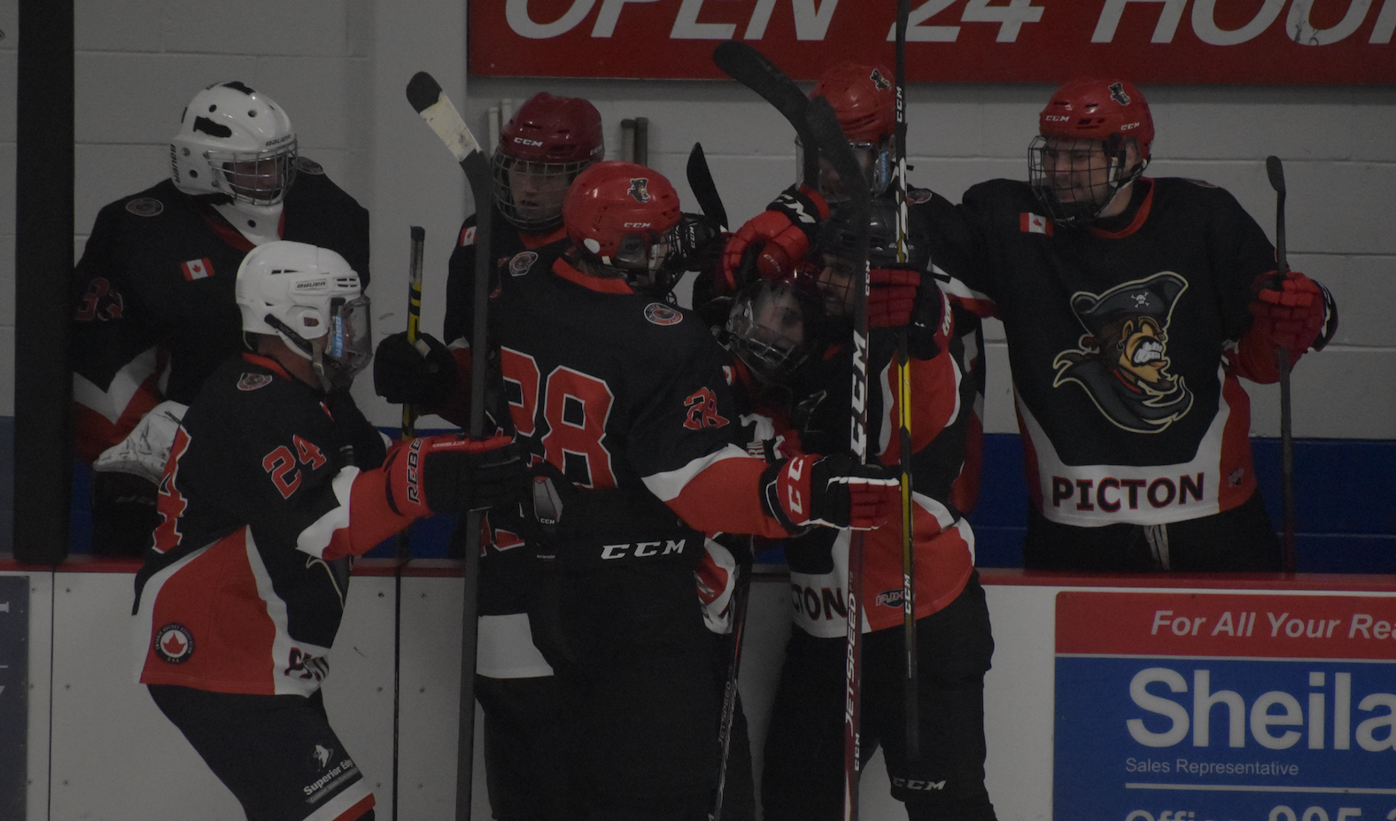 <p>Teammates mob Brayden Adams after he scored a breakaway goal in the second period of Saturday&#8217;s 4-3 preseason win in Port Hope. (Gazette Staff)</p>
