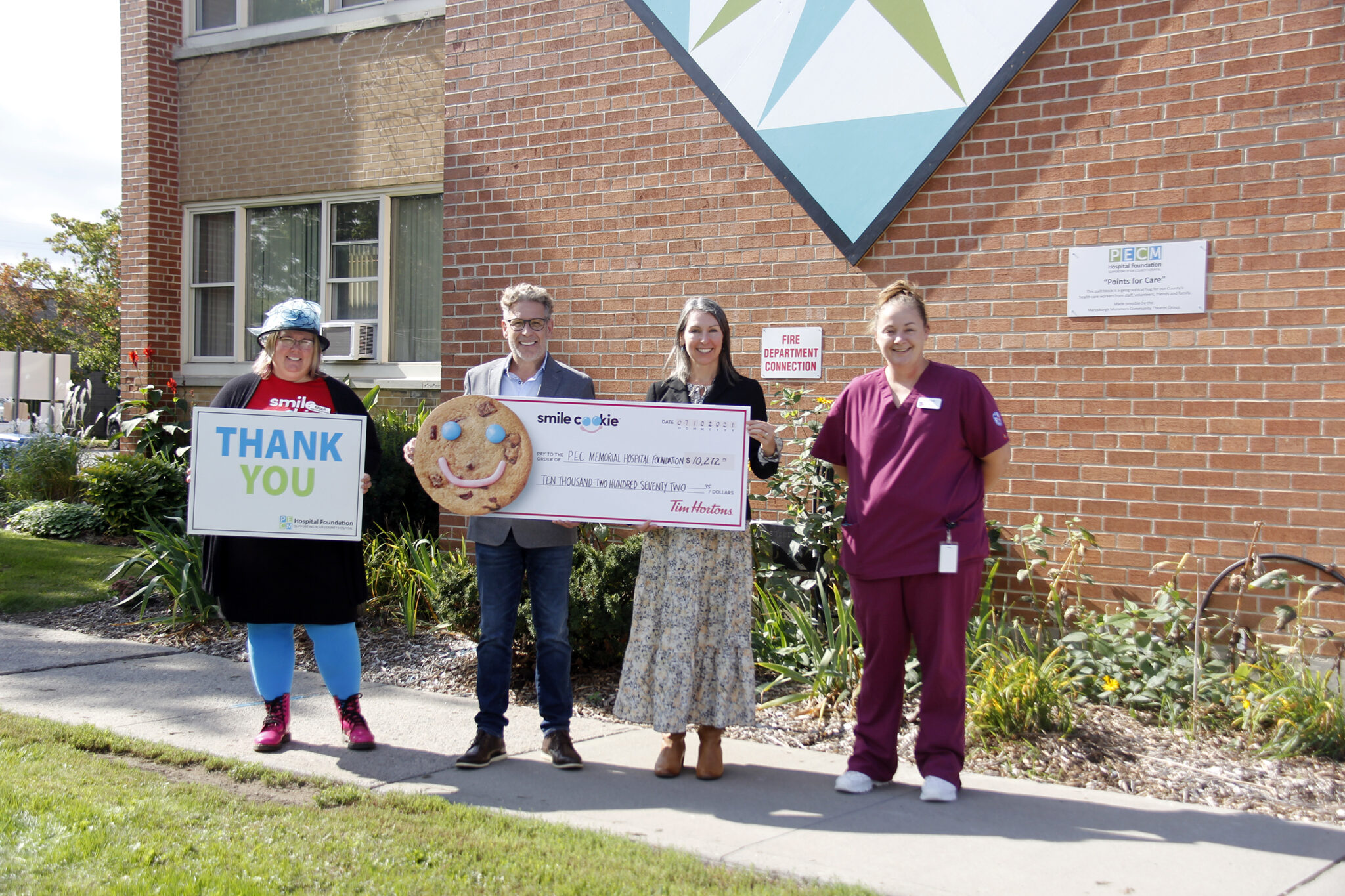 <p>ALL SMILES Tim Hortons announced that $10,272 was raised for the PECMHF from the 2021 Smile Cookie Campaign. Pictured at QHC Prince Edward County Memorial Hospital from left: Briar Boyce, senior development officer with PECMHF; Paul Massey, owner of the Picton and Wellington Tim Hortons; Shannon Coull, executive director of the PECMH Foundation and Corrina Hurlbert, a PSW student and former Tim Hortons employee. (Desirée Decoste/Gazette staff)</p>
