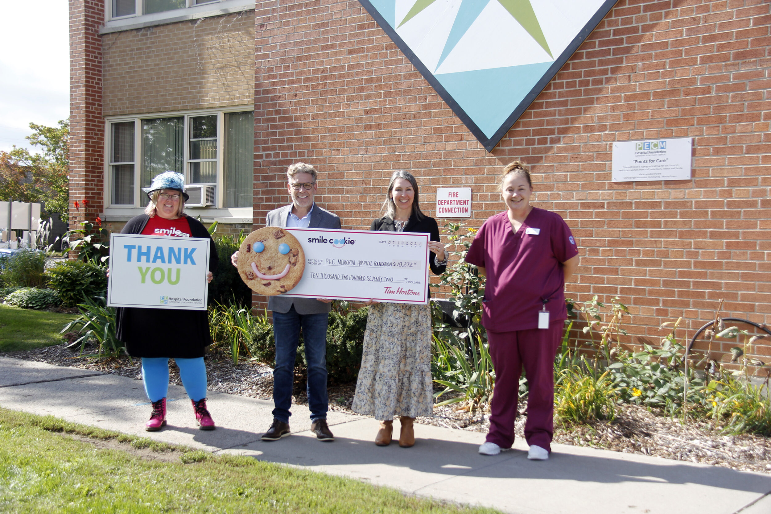<p>ALL SMILES Tim Hortons announced that $10,272 was raised for the PECMHF from the 2021 Smile Cookie Campaign. Pictured at QHC Prince Edward County Memorial Hospital from left: Briar Boyce, senior development officer with PECMHF; Paul Massey, owner of the Picton and Wellington Tim Hortons; Shannon Coull, executive director of the PECMH Foundation and Corrina Hurlbert, a PSW student and former Tim Hortons employee. (Desirée Decoste/Gazette staff)</p>
