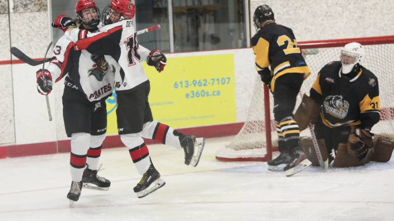 <p>Owen Dever leaps into the arms of Landon McLellan after the former set up the latter for the game’s first goal Saturday night. (Shawna Adams for the Gazette)</p>
