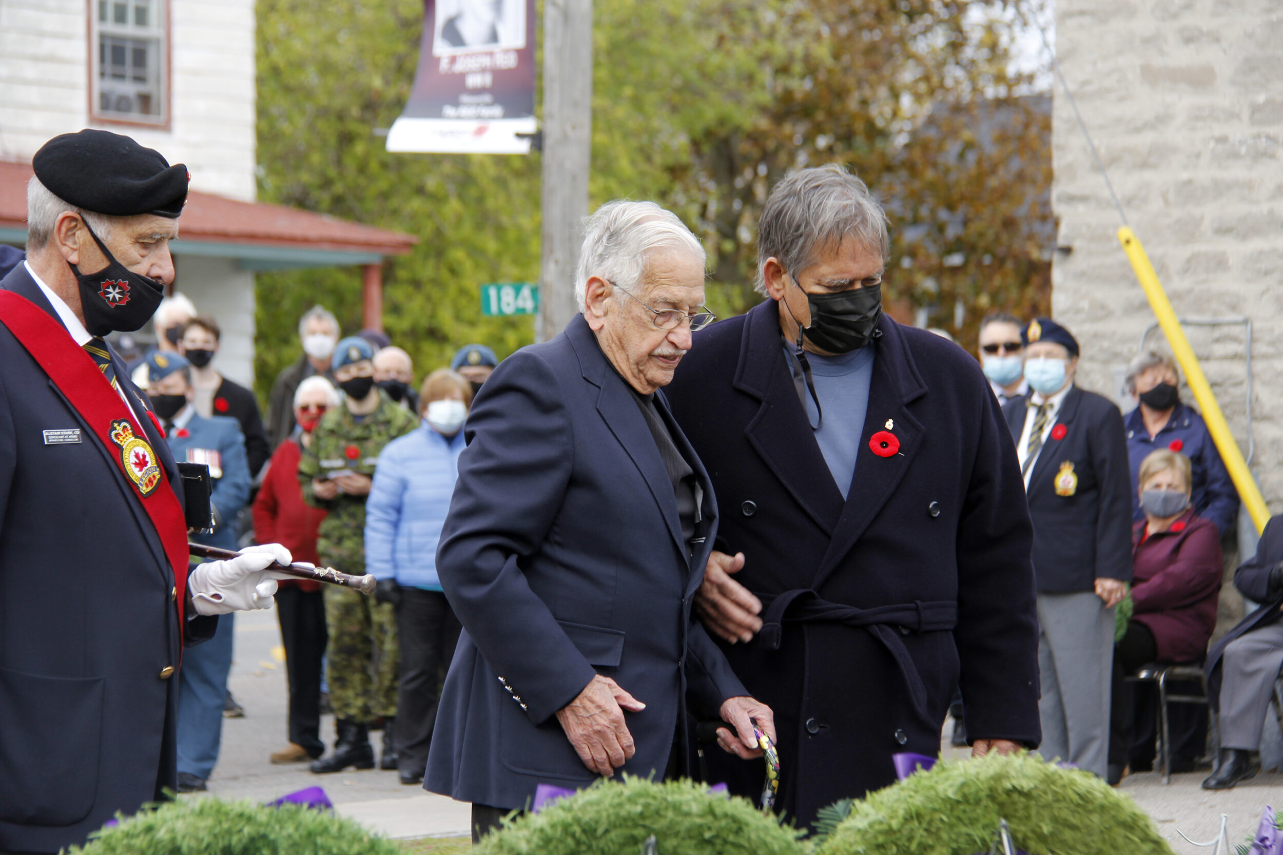 <p>REMEMBER THE TIMES – WWII naval veteran Joseph Reid is escorted by his son Joe Jr. at the 2021 Remembrance Day event in Consecon. (Desirée Decoste/Gazette Staff)</p>
