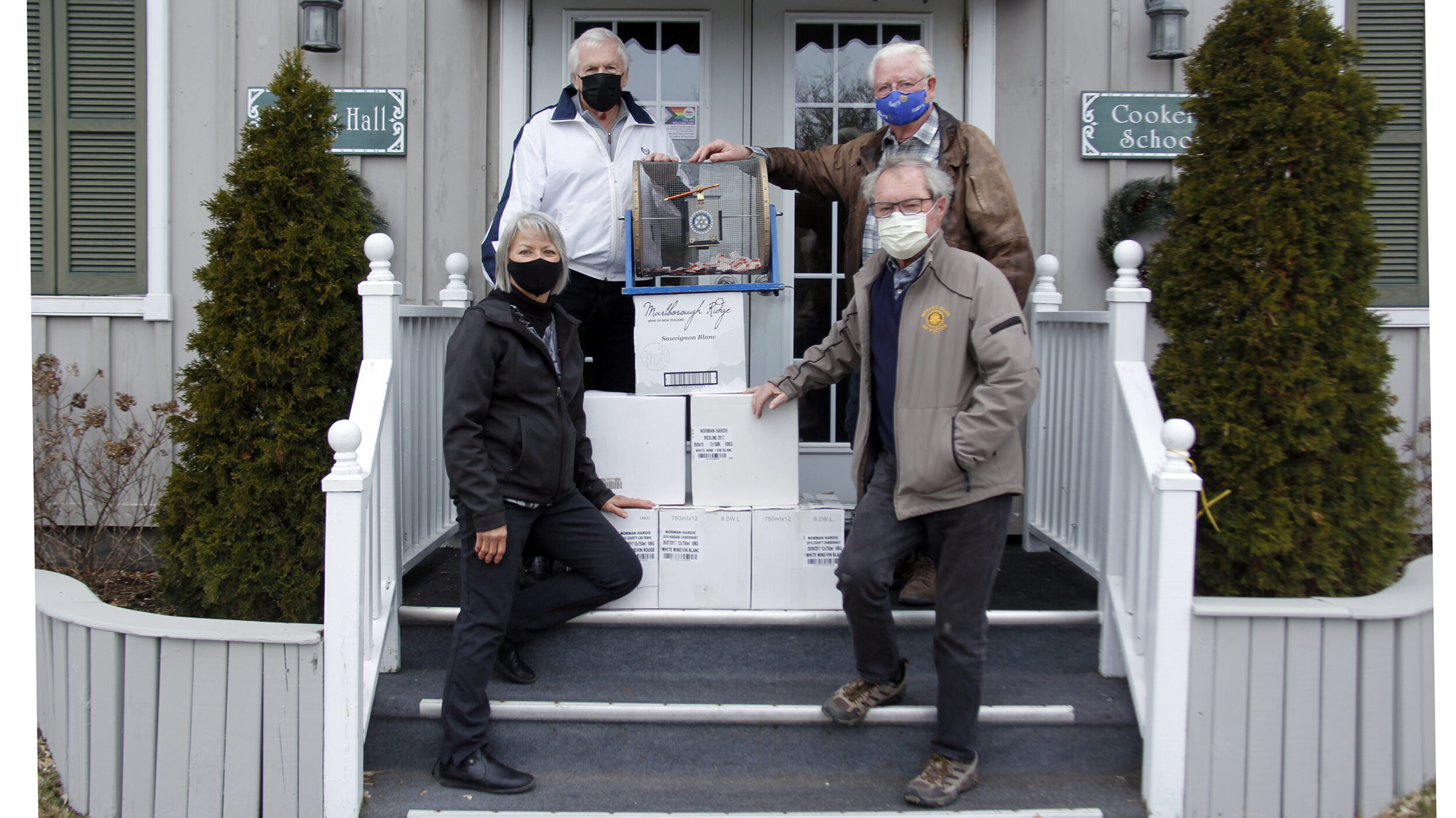 <p>WALL OF WINE (back left to right) Uncork Canada Committee member Bob Bird, Rotary Club of Picton Treasurer Maurice Carlier, (front left) Bev Carnahan, Director of the All Canadian Wine Competition and Uncork Canada Committee member Rob Leek stood out front of The Warning House on Thursday after drawing the winning ticket for the Wall of Wine, 72 bottles of wine. (Desirée Decoste/Gazette staff)</p>

