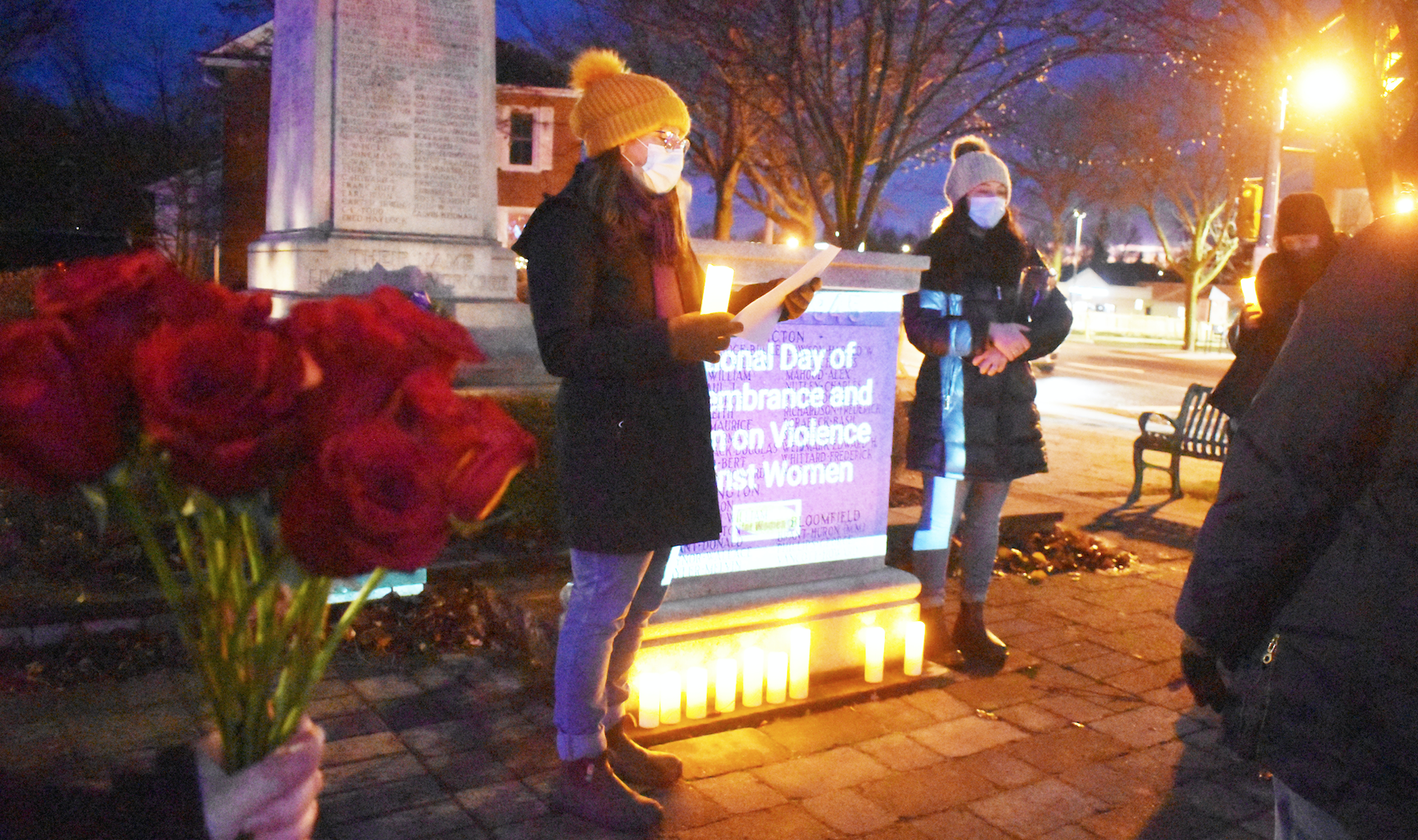 <p>High wind and wintery conditions could not dissuade a solemn gathering at Picton’s cenotaph Monday night at an Alternatives for Women-led ceremony that remembered the 14 young women slain December 6, 1989 at Polytechnique Montréal. (Jason Parks/Gazette Staff)</p>
