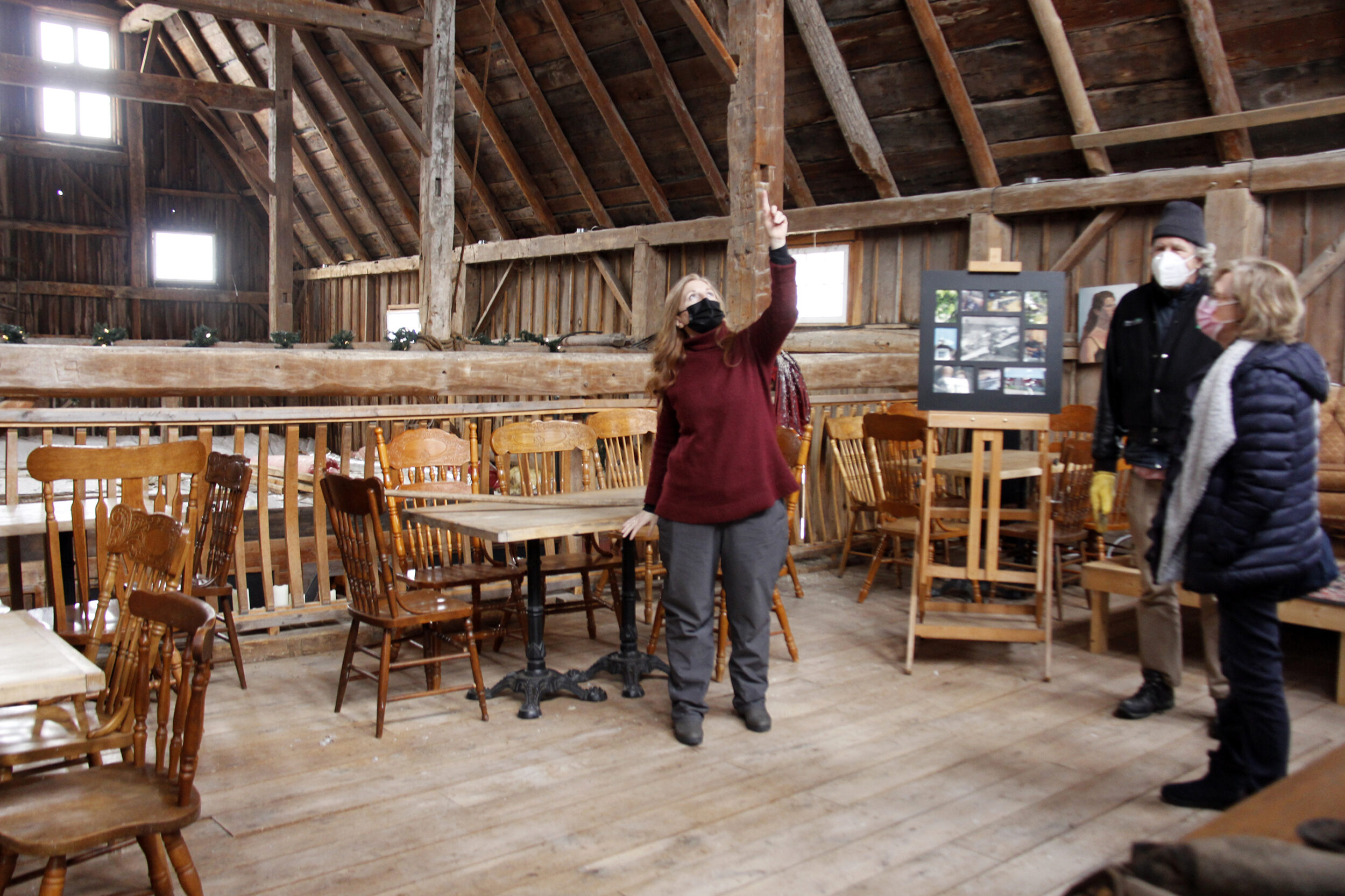 <p>Owner of Karlo Estates Winery Sherry Karlo, hosted historic barn tours as part of Flashback February for 2022. (left) Karlo is pointing out where the original frame of the barn was when it was first built as well as the work they had done when they purchased the property in 2005. (Desirée Decoste/Gazette staff)</p>
