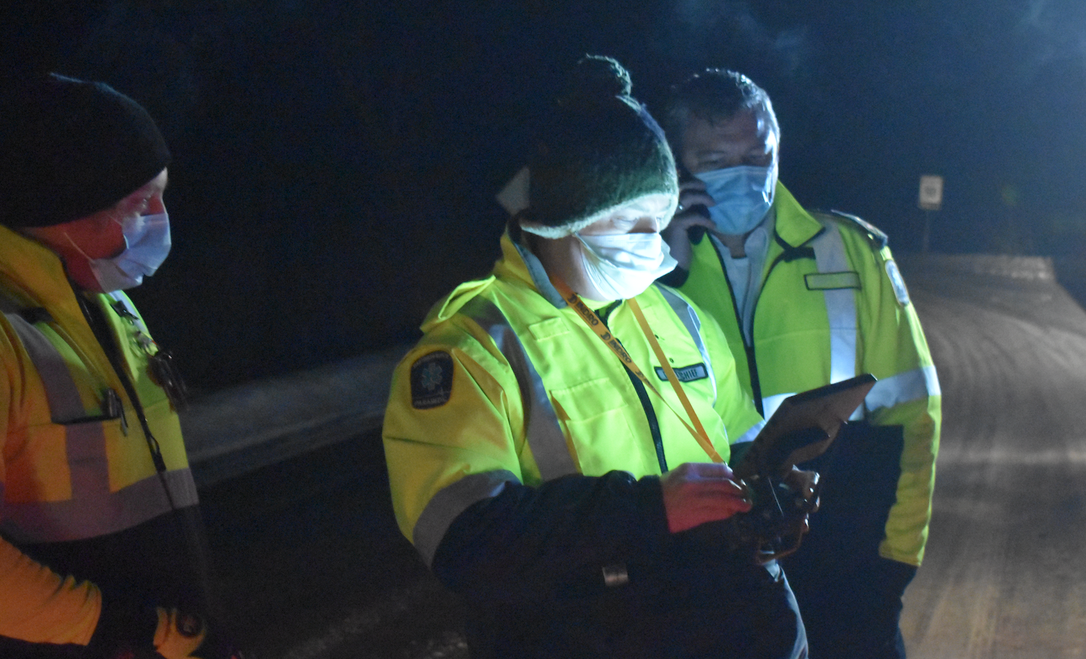 <p>Members of Hastings Quinte Paramedic Services watch a screen as a thermal imaging drone flies high above the Dunes on Monday night. (Jason Parks/Gazette Staff)</p>
