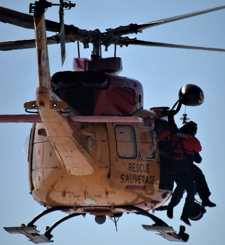<p>An angler is hoisted aboard a JRCC rescue helicopter Sunday afternoon. (Janyce Mann for the Gazette)</p>
