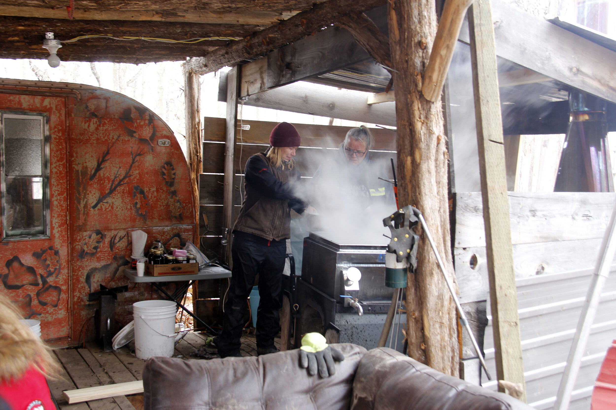 <p>MAPLE GOODNESS<br />
Jacqueline Jesser, Outdoor Event &amp; Tour Manager at The Campbell’s Orchards scoops some almost maple syrup from the evaporator during the Walk and Talk to their Murray’s Sugarbush last weekend. (Desirée Decoste/Gazette staff)</p>
