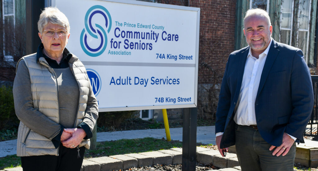 <p>Prince Edward County Community Care for Seniors Association Chair Barb Proctor and Bay of Quinte MPP Todd Smith outside the Association’s King St. Office on Tuesday. The province presented $49,462.24 to Community Care for their Active Living Centre operations.  (Submitted photo)</p>
