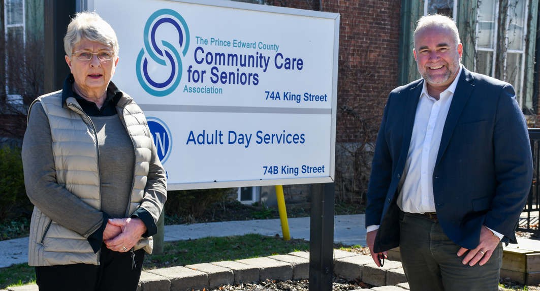 <p>Prince Edward County Community Care for Seniors Association Chair Barb Proctor and Bay of Quinte MPP Todd Smith outside the Association’s King St. Office on Tuesday. The province presented $49,462.24 to Community Care for their Active Living Centre operations.  (Submitted photo)</p>
