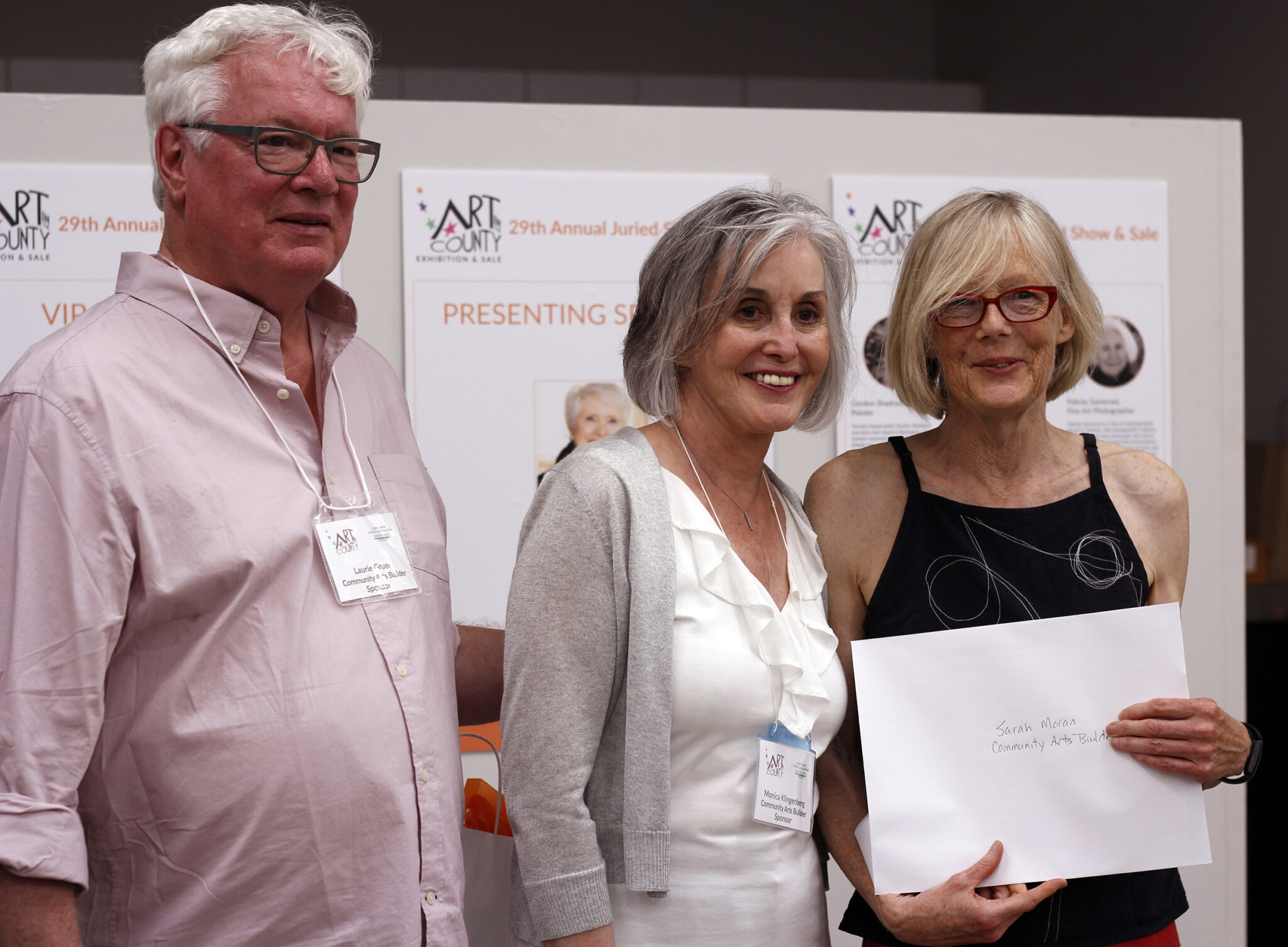 <p>(From left) AITC sponsors Laurie Gruer and Monica Klingenberg present Community Arts Builder award winner Sarah Moran with her award. (Desirée Decoste/Gazette staff)</p>
