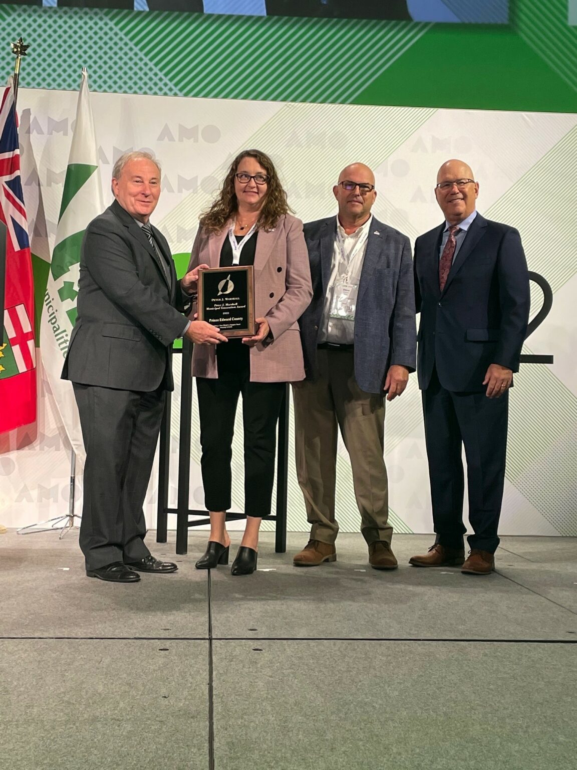<p>(At Left) Jamie McGarvey, President of the Association of Municipalities of Ontario and (Right) The Honourable Steve Clark, Minister of Municipal Affairs and Housing, present the 2022 Peter J. Marshall Award to County CAO Marcia Wallace and Mayor Steve Ferguson. (Submitted Photo)</p>
