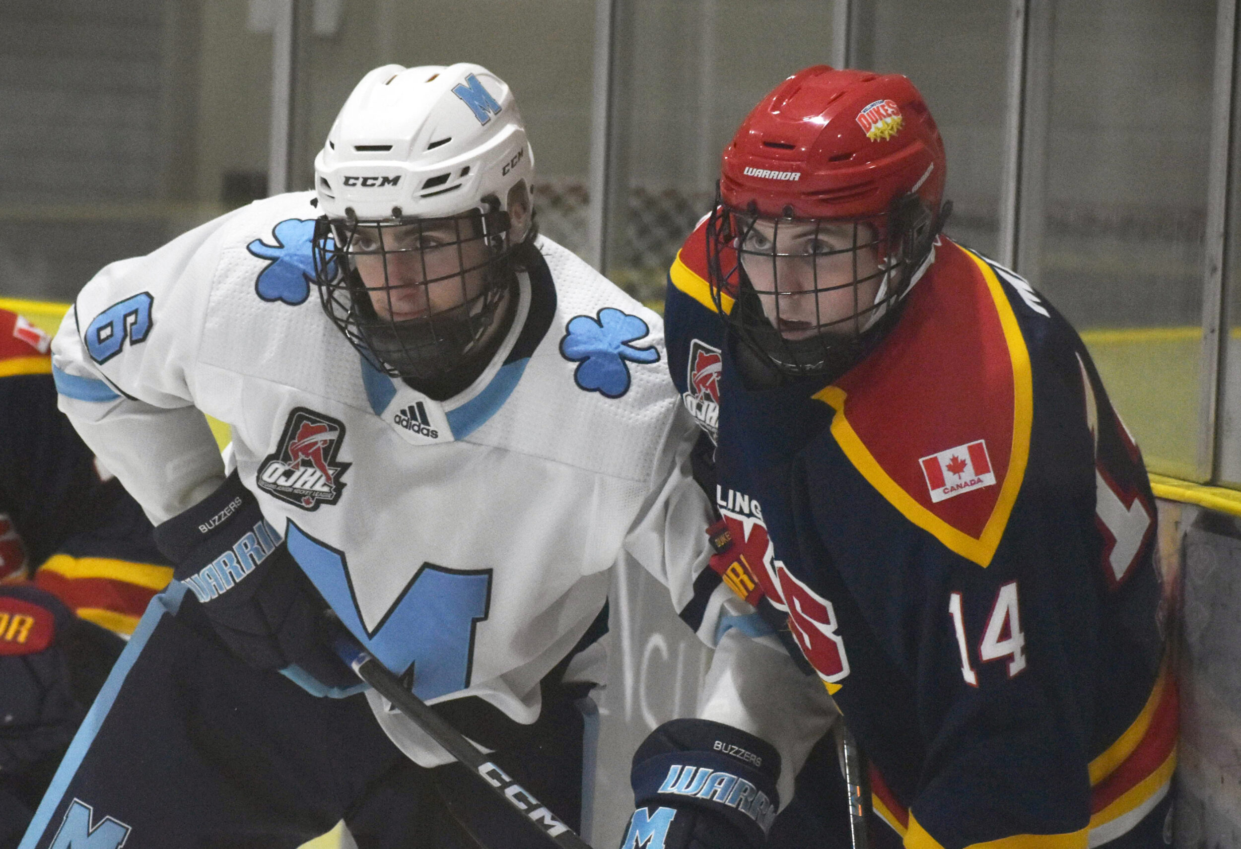<p>Wellington Dukes forward Ryan Smith had the game winning goal against Nathan Bannister and the St. Michael’s Buzzers on Friday night at Lehigh Arena. (Jason Parks/Gazette Staff)</p>
