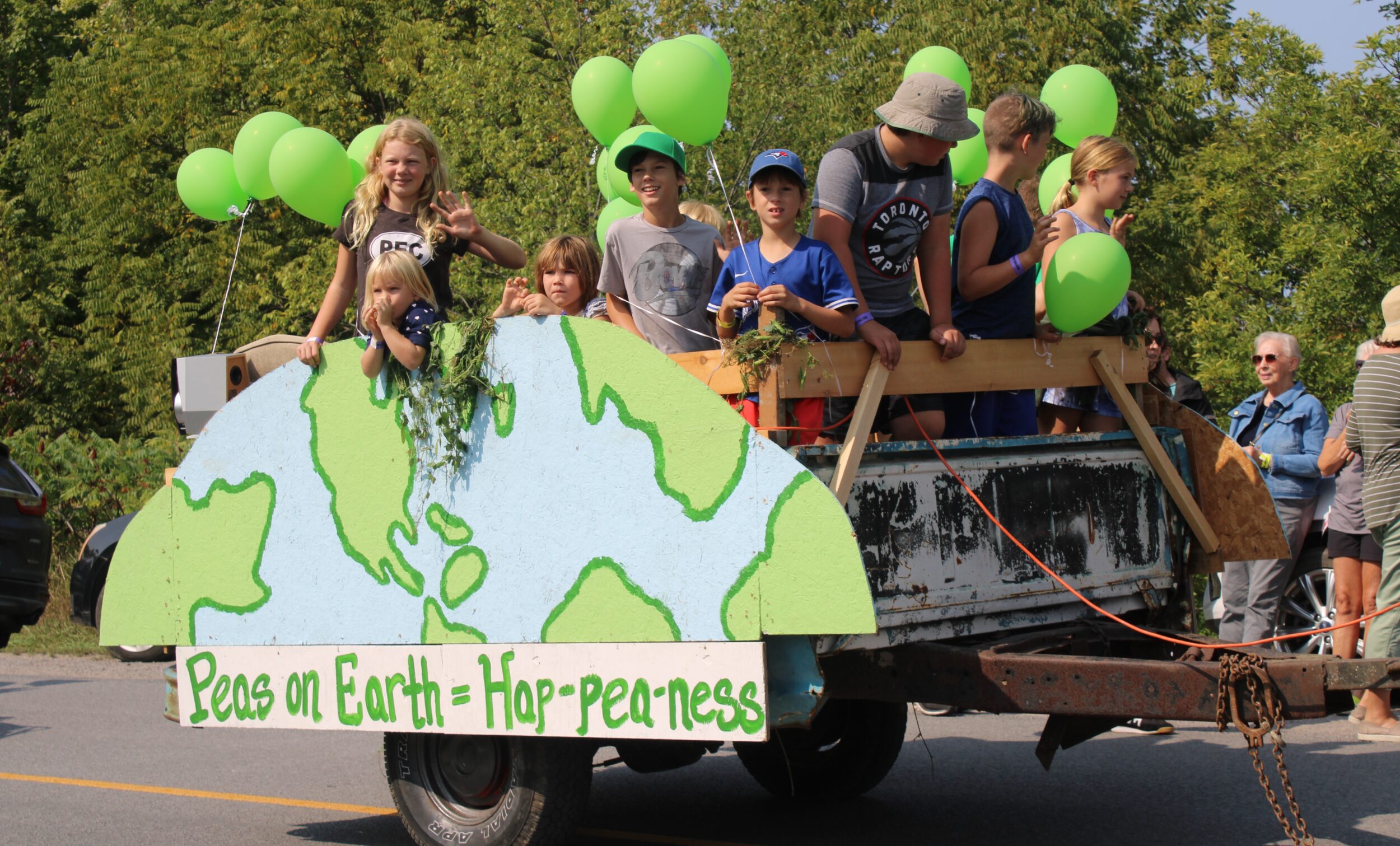 <p>PEAS ON EARTH- Children were all smiles as they participated in the parade. (Sarah Williams/Gazette Staff)</p>
