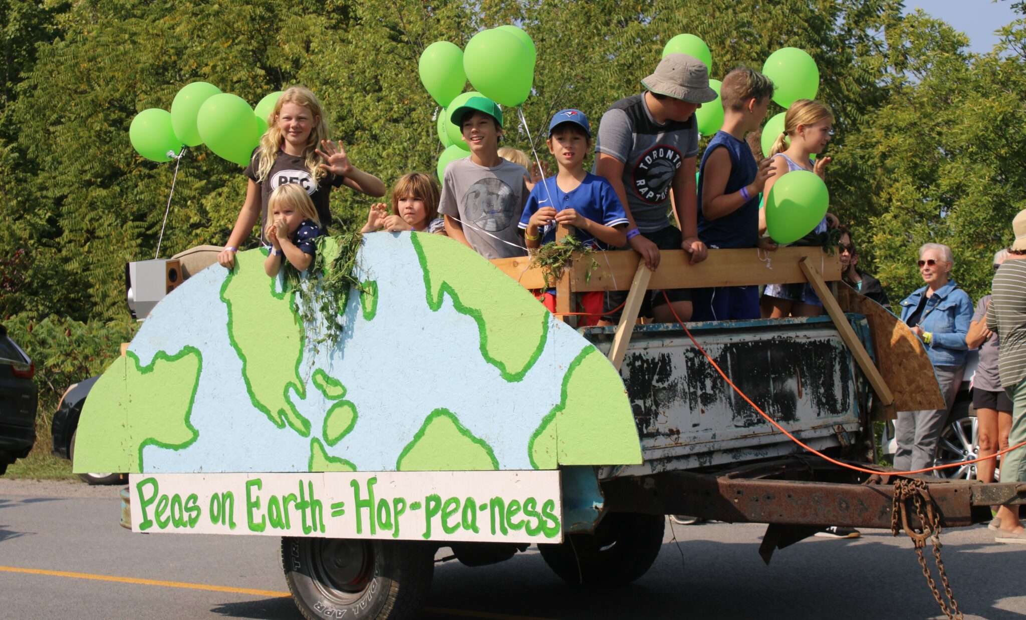 <p>PEAS ON EARTH- Children were all smiles as they participated in the parade. (Sarah Williams/Gazette Staff)</p>
