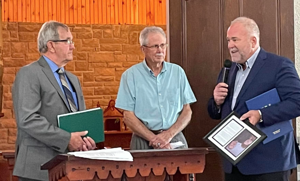 <p>(From left) 2022 Wall of Fame honouree Dr. John Hancock, Prince Edward Federation of Agriculture member Dennis Dick and Bay of Quinte MPP Todd Smith at Farmtown Park earlier this fall. (Submitted Photo)</p>
