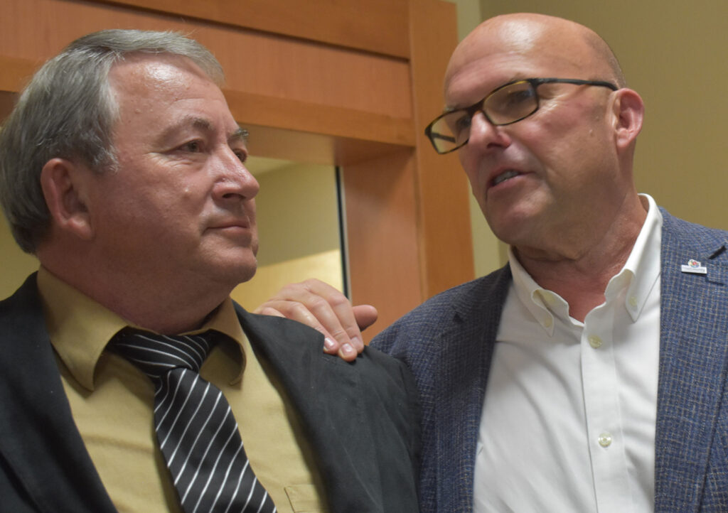 <p>BOOKING A RETURN TRIP TO SHIRE HALL Candidate Terry Shortt and incumbent County of Prince Edward Mayor Steve Ferguson share a moment after the results of the 2022 Municipal Election were announced at Highline Hall Monday night.</p>
