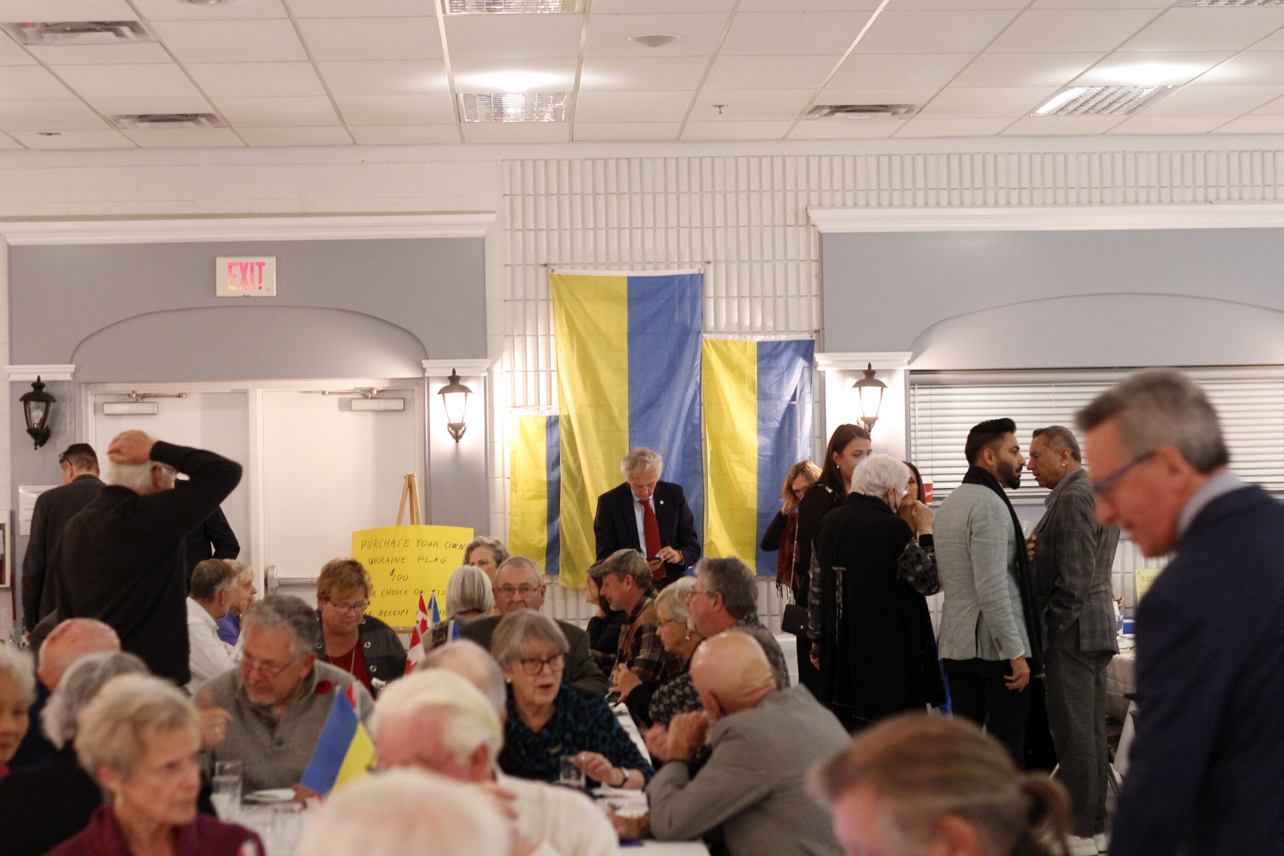 <p>Ukrainian flags being sold at the Rotary Club of Picton’s Ukrainian evening on November 8 in Rotary Hall at the Picton arena. Over $35,000 was raised. (Desirée Decoste/Gazette staff)</p>
