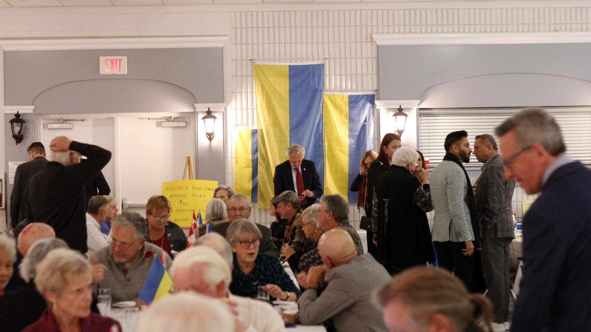 <p>Ukrainian flags being sold at the Rotary Club of Picton&#8217;s Ukrainian evening on November 8 in Rotary Hall at the Picton arena. Over $35,000 was raised. (Desirée Decoste/Gazette staff)</p>
