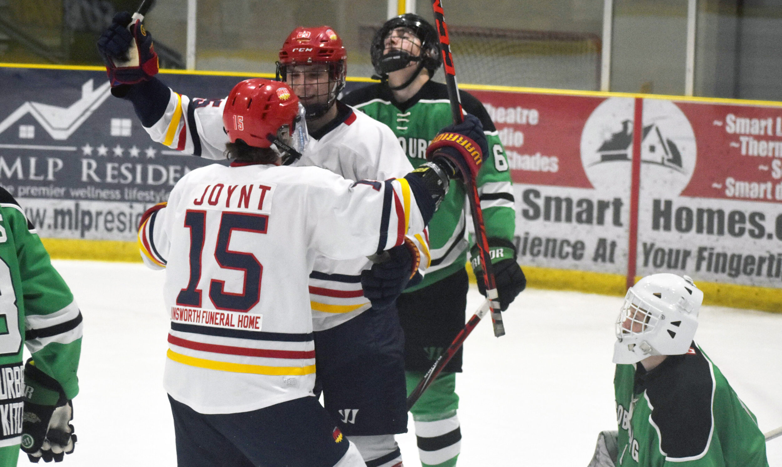 <p>THAT SINKING FEELING- Barrett Joynt celebrates Jared Langdon’s seventh goal of the season while Cobourg’s Adam Barone and Ryan Prios can only look skyward as the host Wellington Dukes notch their sixth goal of the night en route to a 9-2 win Friday. (Jason Parks/Gazette Staff)</p>
