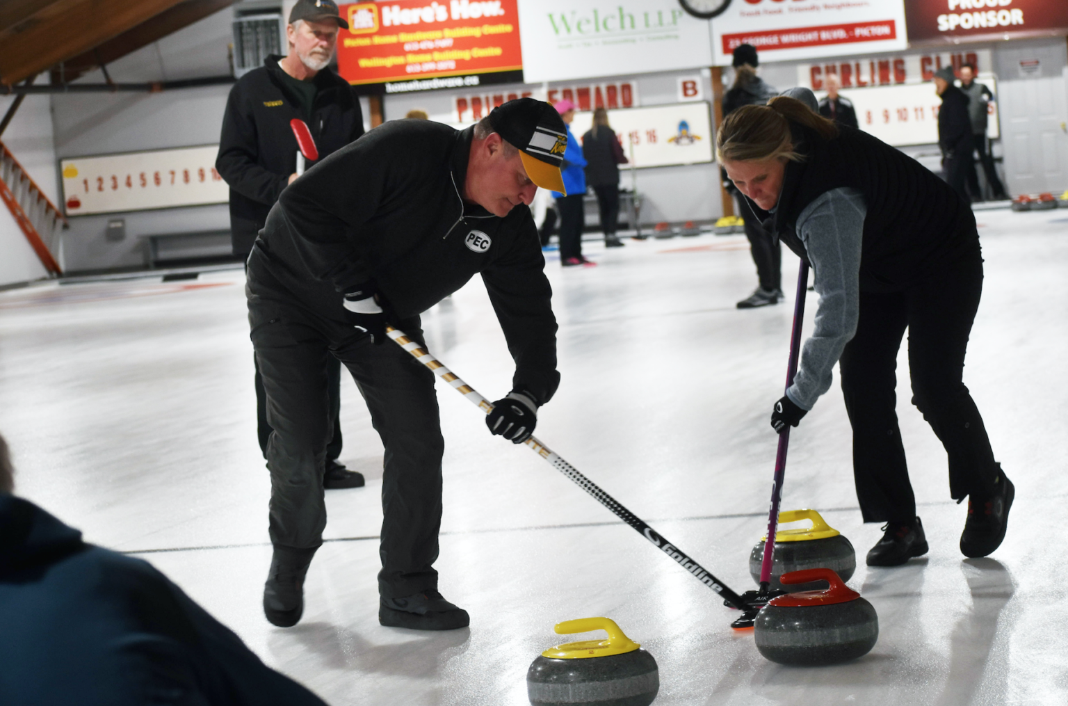 <p>HEADING TO THE HOUSE-Jim and Lisa Lindsay sweep their rinks stone towards the house at the Prince Edward Curling Club. The Club is organizing a 24 hour Curl-A-Thon later this year in support of the Back the Build campaign for the new Prince Edward County Memorial Hospital. (Jason Parks/Gazette Staff)</p>

