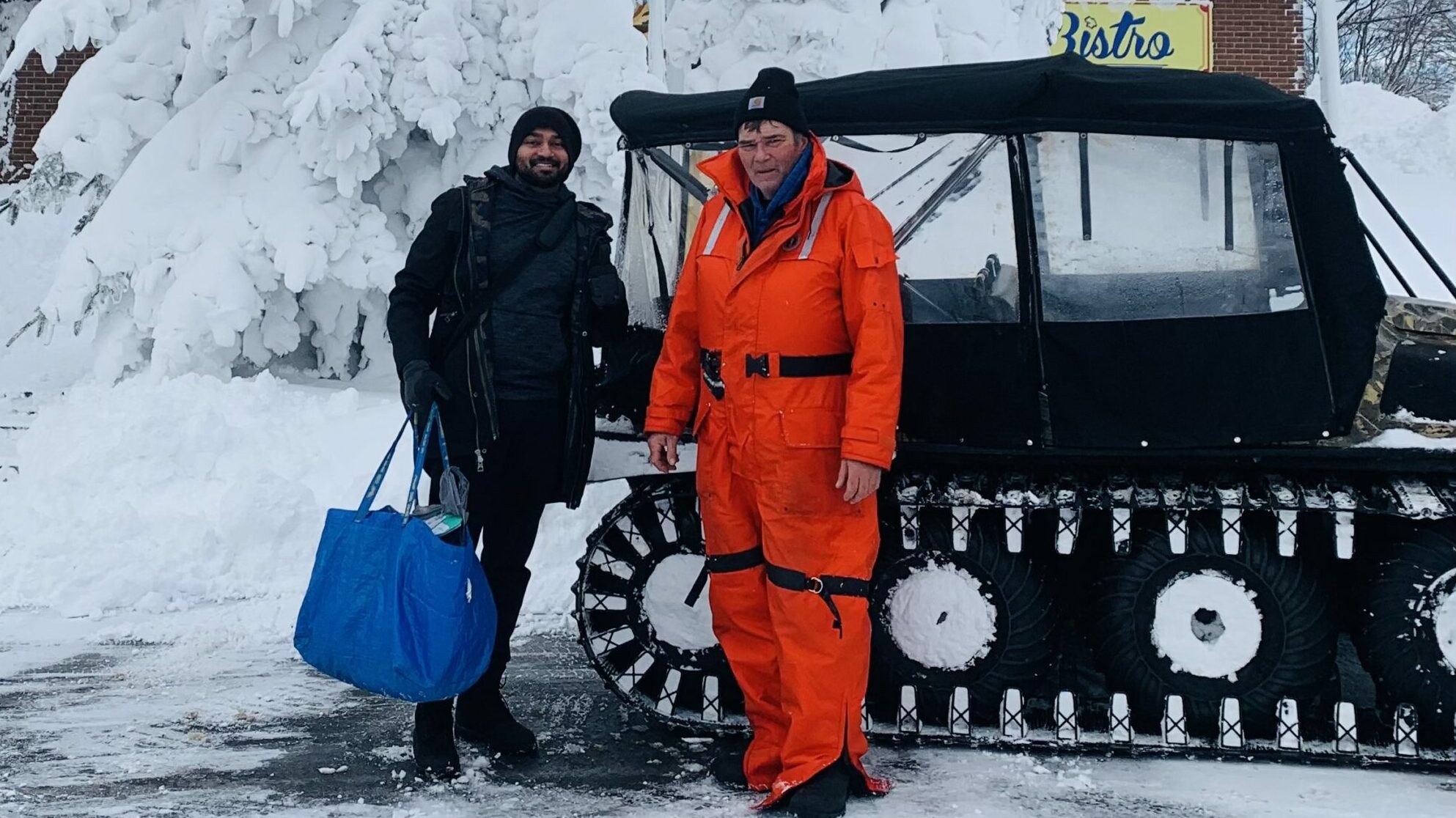 <p>Aravind Remesan and Dan Cole on Christmas morning prior to delivering medication to Hallowell House. Remesan became stranded in Bloomfield and relied on the kindness of the community to complete his delivery. (Submitted photo)</p>
