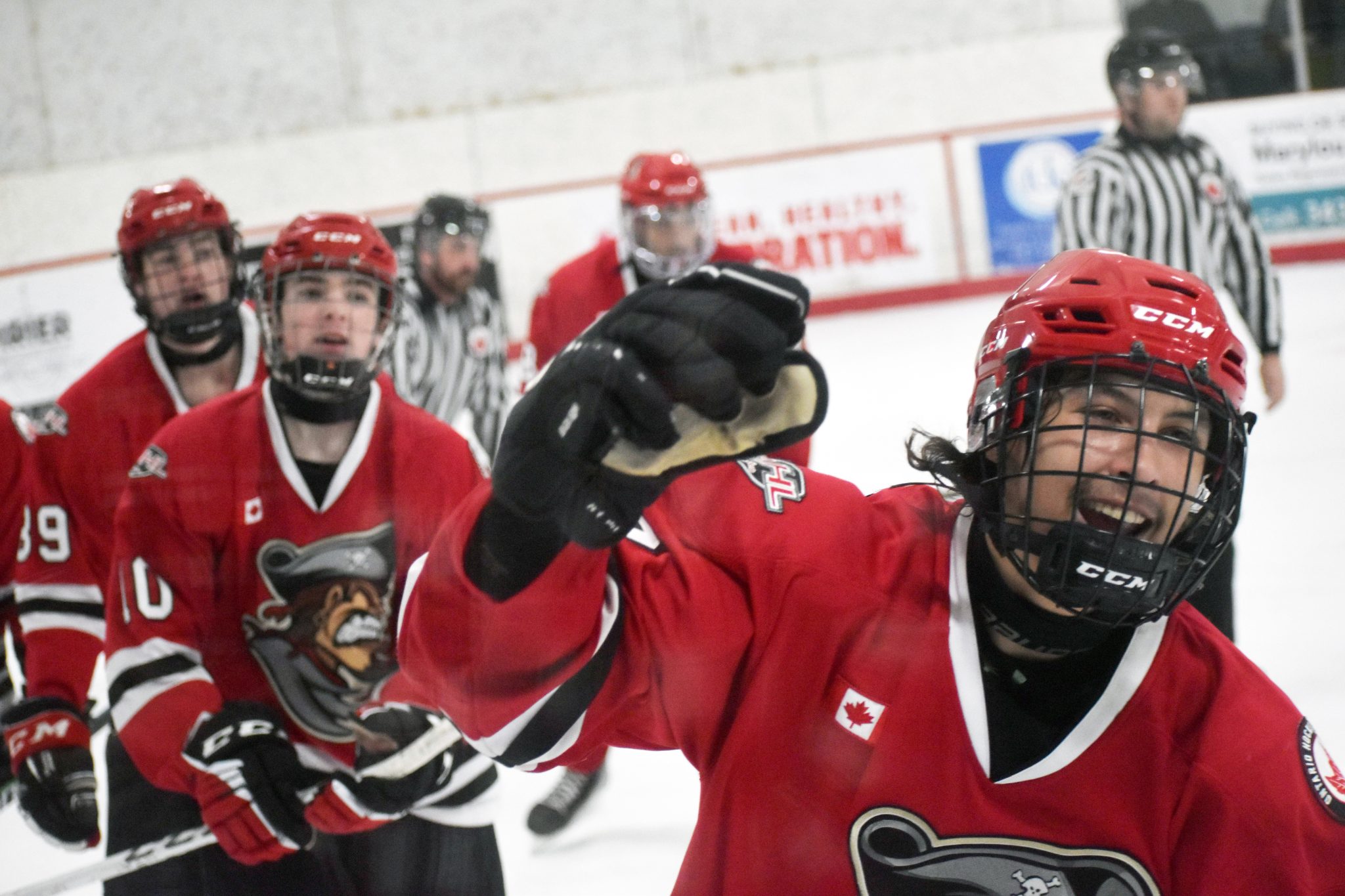 <p>A REASON TO SMILE- Consecon’s Nick Kirby leads the way to the Picton bench after scoring a goal Saturday night in Frankford. Kirby’s effort wound up being the game winner and the County native would score a clutch game tying goal a night later in Campbellford. Both goals were set up by (at left)  #10 Cole Stevenson. (Gazette Staff)</p>
