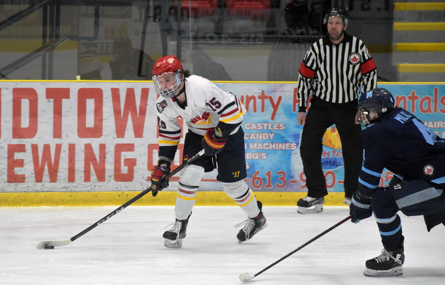 <p>Barrett Joynt gets around Thomas Millic during action in Game Five. The Dukes bested the Buzzers 6-3 to move on to the second round of the OJHL playoffs. (Jason Parks/Gazette Staff)</p>
