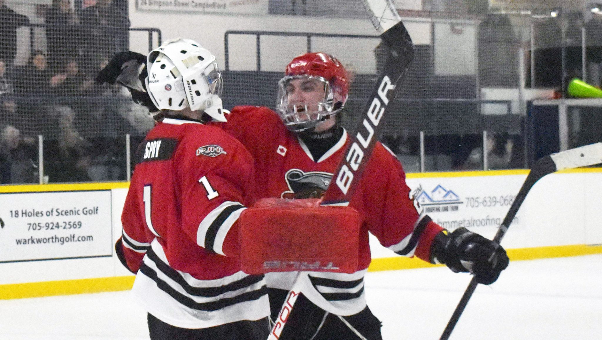 <p>Picton Pirates defenceman Cole Lavender embraces Brady Spry Tuesday after the goalie turned in a 35 save shutout to help close out the Campbellford Rebels 2-0. (Gazette Staff)</p>
