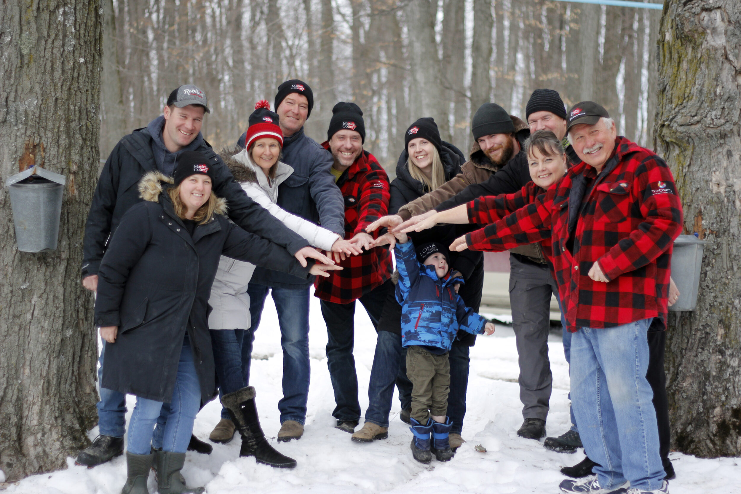 <p>ALL TOGETHER FOR MAPLE 2023- Producing members of this year’s Maple in the County gathered Friday to announce the return of the annual Maple Syrup Festival. From Left to Right are Brittany and Phil Roblin of Roblin’s Maple Syrup, Sue and Todd Vader of Vader’s Maple Syrup, Chris, Jess and Asher Armstrong of LOHA Farms, Rylan and Dean Foster of Fosterholm Farms and Janice and Ron Hubbs of Sweetwater Cabin. (Desirée Decoste/Gazette Staff)</p>
