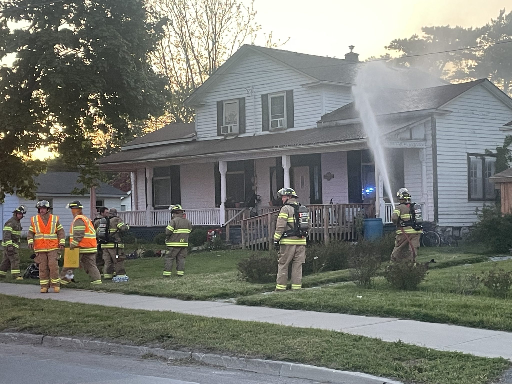 <p>Prince Edward County Fire and Rescue crews work to extinguish a fire at 156 Main St. in Wellington Sunday evening. (Jason Parks/Gazette Staff)</p>

