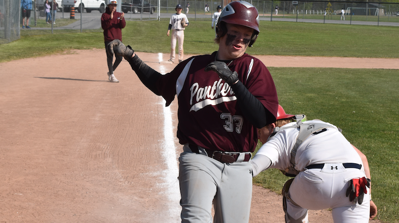 <p>PECI’s Dakin Jones avoids the tag of St. Theresa backstop Ben Buxton to score a run in the 5th inning during the Panthers 11-5 victory over the Titans in Melrose on Thursday. With the win, PECI earned hosting honours for the 2023 Bay of Quinte baseball championships at Field of Dreams. PECI plays Eastside at 9:30 a.m. tomorrow. (Jason Parks/Gazette Staff)</p>
