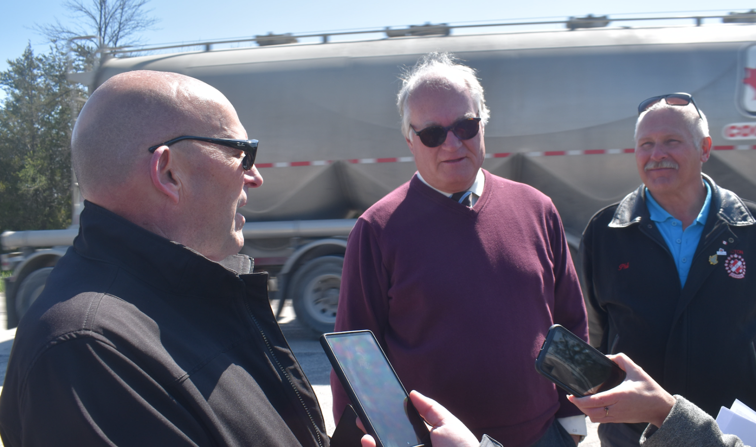 <p>(From Left) Mayor Steve Ferguson, Councillors Chris Braney and Phil St. Jean discuss a potential County Road 49 rehabilitation project as a semi truck rumbles past Thursday morning. (Jason Parks/Gazette Staff)</p>
