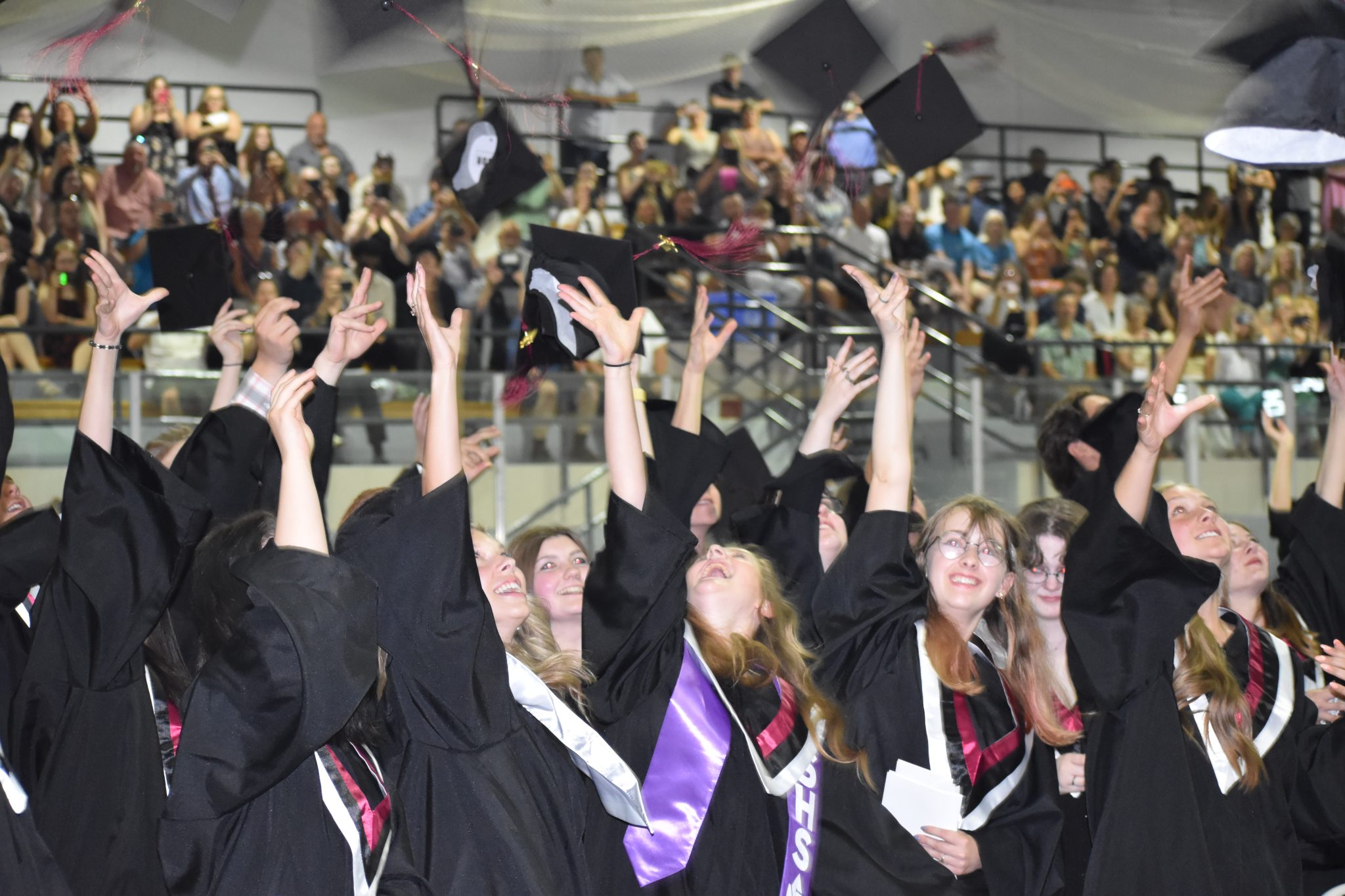 <p>LET THEM FLY- PECI Graduates fling mortar boards into the air Thursday evening. (Jason Parks/Gazette Staff)</p>
