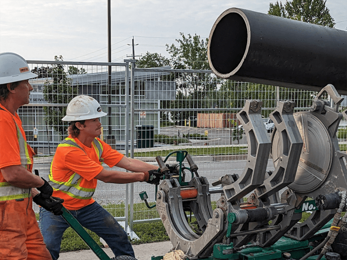 <p>City of Quinte West employees move a water pipe into position during repair operations last week. (City of Quinte West photo)</p>
