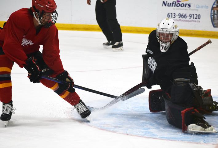 <p>Stretched out  Goaltender Liam Boyer makes a save on Wyatt Gregory during the Wellington Dukes summer identification camp in Belleville on Saturday. The team is celebrating its 35th season of Jr. A hockey in the village.   (Jason Parks/Gazette Staff)</p>
