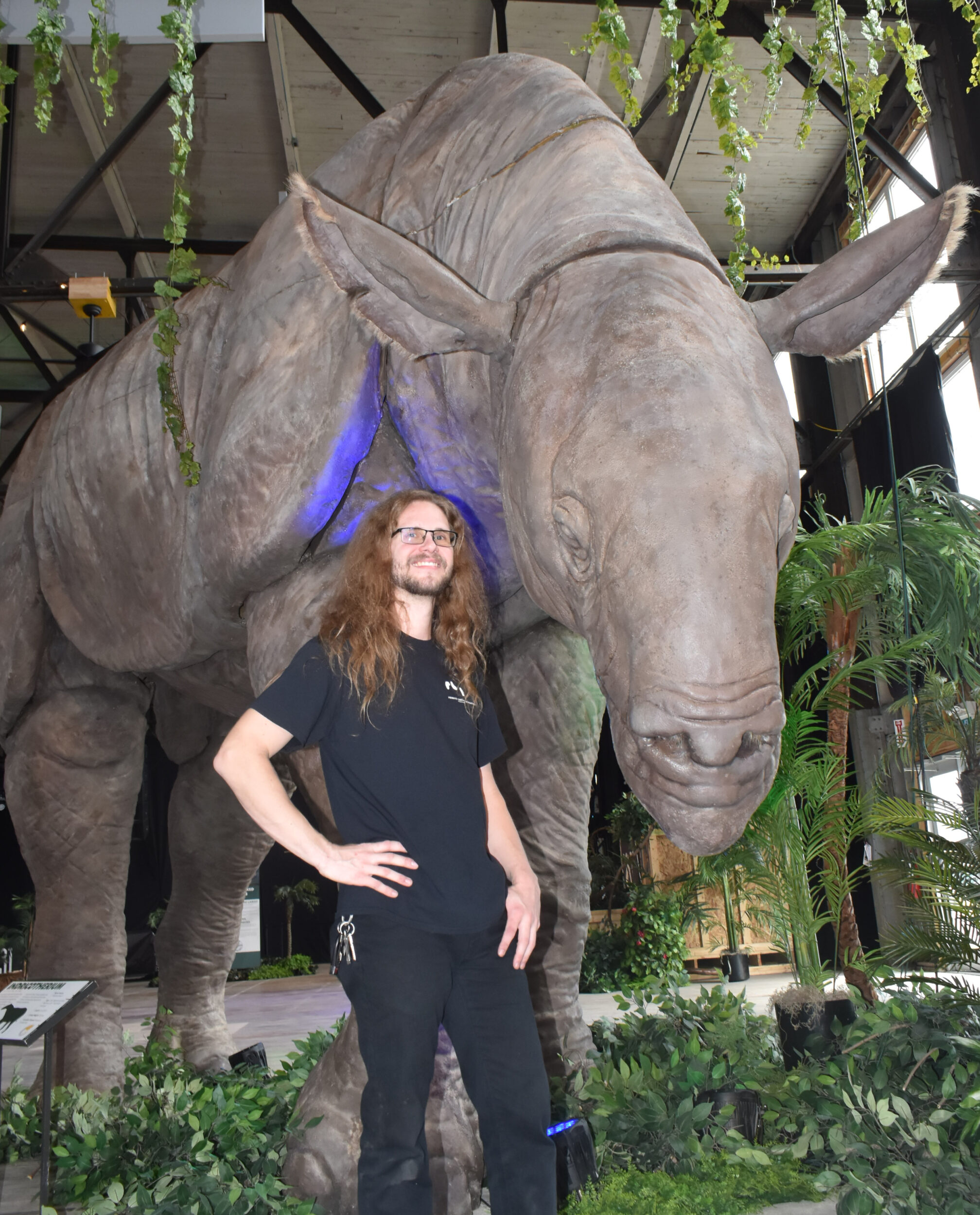 <p>FRIENDS IN HIGH PLACES- Research Casting International’s Ozz Macdonald with a life-sized example of an indricotherium, a hornless rhino that lived in what is now known as Pakistan during the Paleogene period. (Jason Parks/Gazette Staff) </p>
