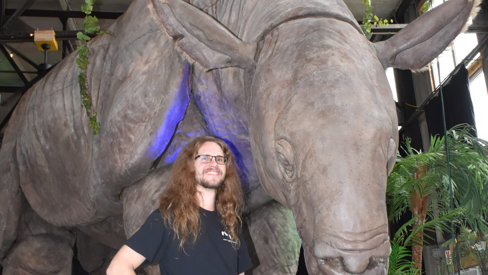<p>FRIENDS IN HIGH PLACES- Research Casting International’s Ozz Macdonald with a life-sized example of an indricotherium, a hornless rhino that lived in what is now known as Pakistan during the Paleogene period. (Jason Parks/Gazette Staff) </p>
