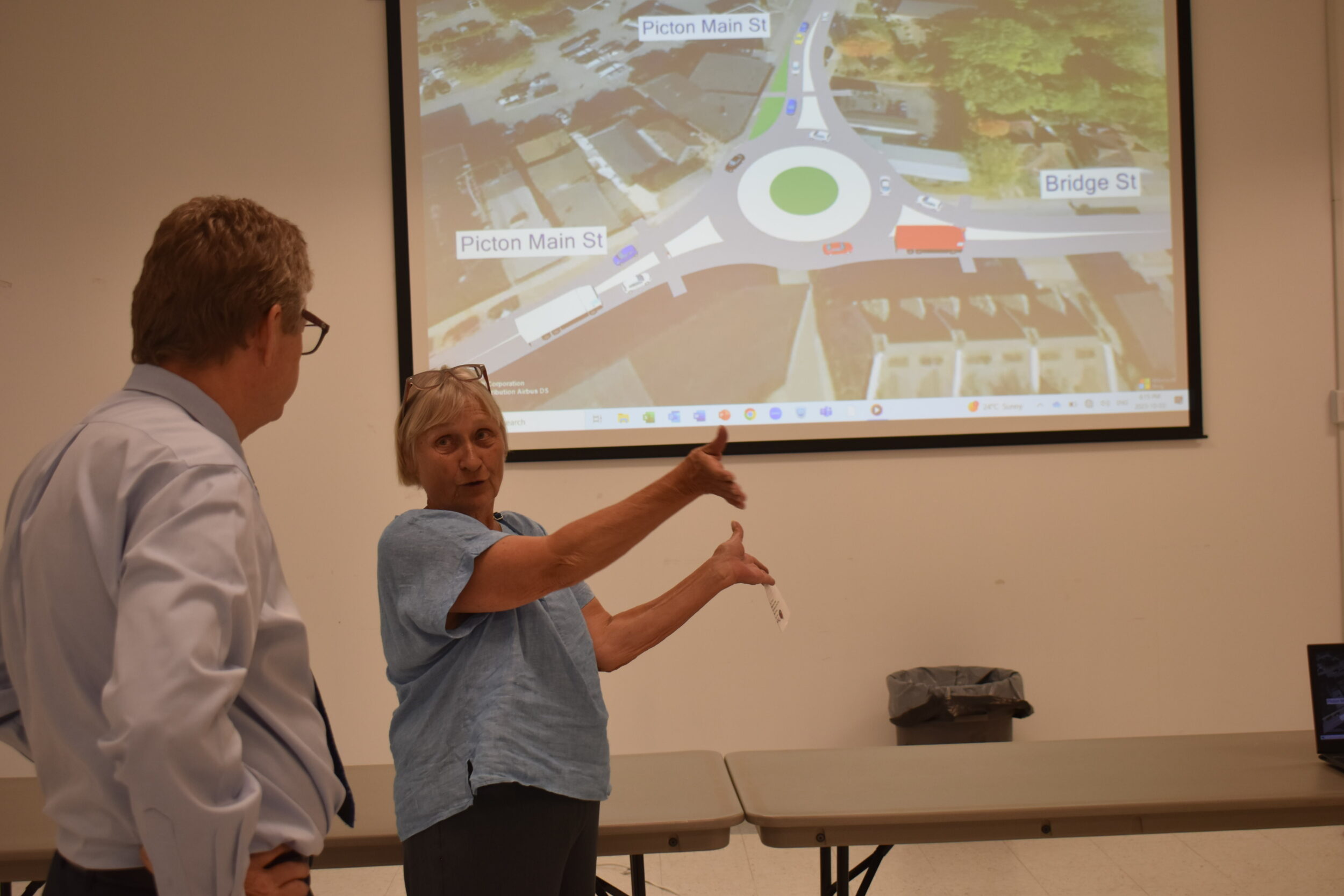 <p>ROUNDABOUT WAY OF THINKING- A local resident speaks with Steve Taylor of BT Engineering at a public information centre Tuesday evening. After careful consideration, County staff are suggesting a traffic circle to replace the current intersection at the top of Picton Town Hill. (Jason Parks/Gazette Staff)</p>
