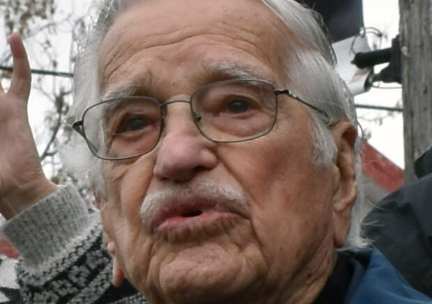 <p>WWII Royal Canadian Navy veteran Joe Reid with his service photo in the background. (Jason Parks/Gazette Staff)</p>
