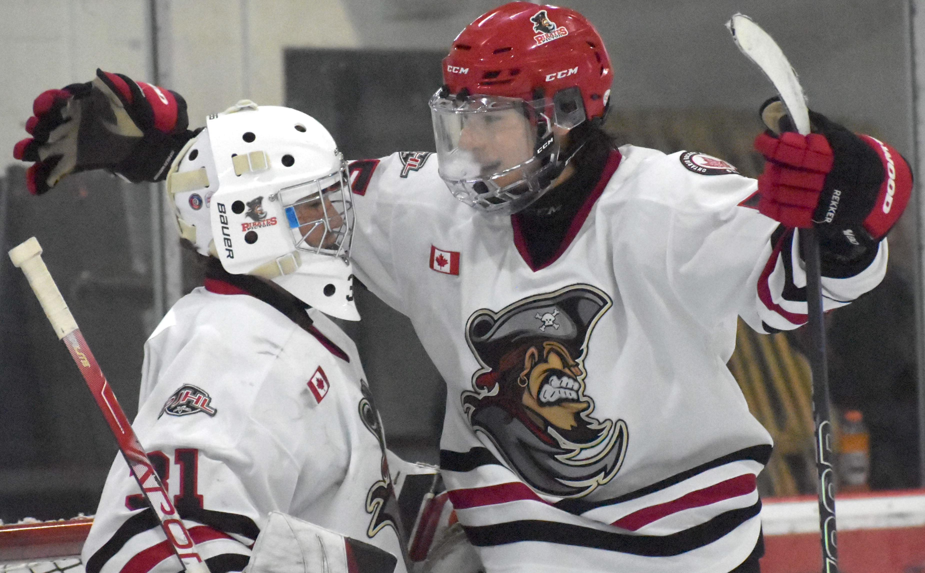 <p>Mack Moyer hugs Nic McGrayne who collected his first junior hockey shutout Thursday. (Jason Parks/Gazette Staff)</p>
