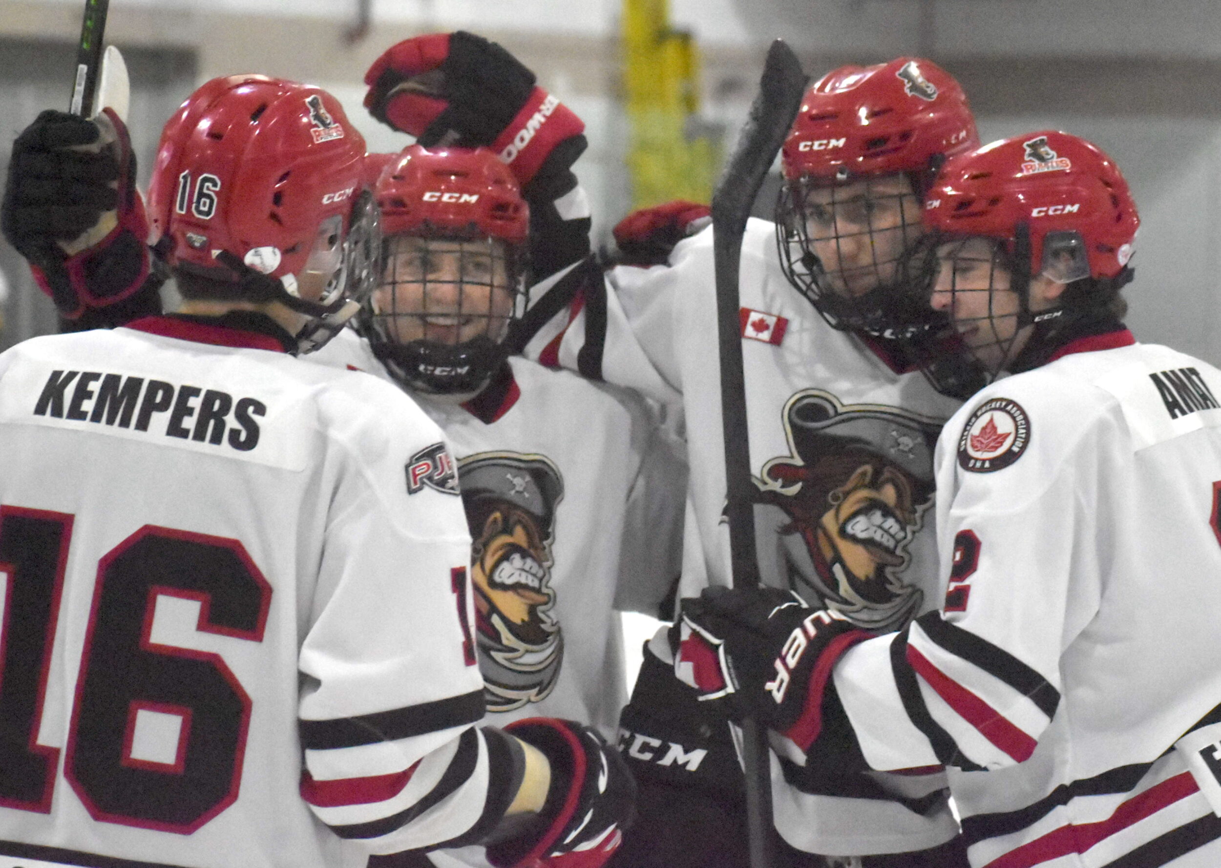 <p>(Centre, from left) Ian Harrison tipped home Cole Lavender’s point shot in overtime to lift the Picton Pirates to a 4-3 win at home Thursday night. (Jason Parks/Gazette Staff)</p>
