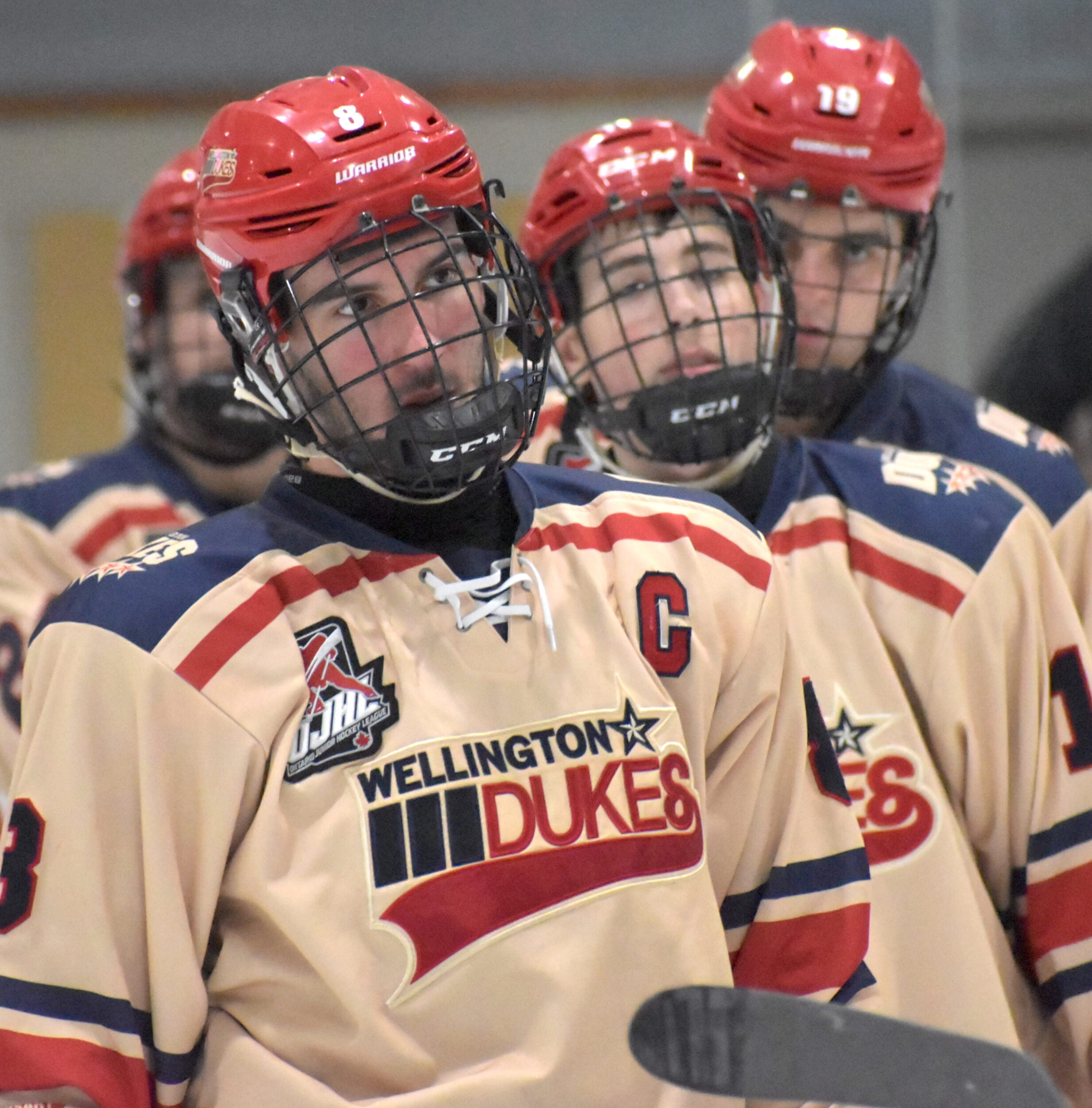 <p>Wellington Dukes captain Dimitri-Alexander Tzaferis leads teammates Zander Latreille and Connor Loerzel to the handshake lineup following the team’s 2-1 overtime loss at Lehigh Arena Saturday. (Jason Parks/Gazette Staff)</p>
