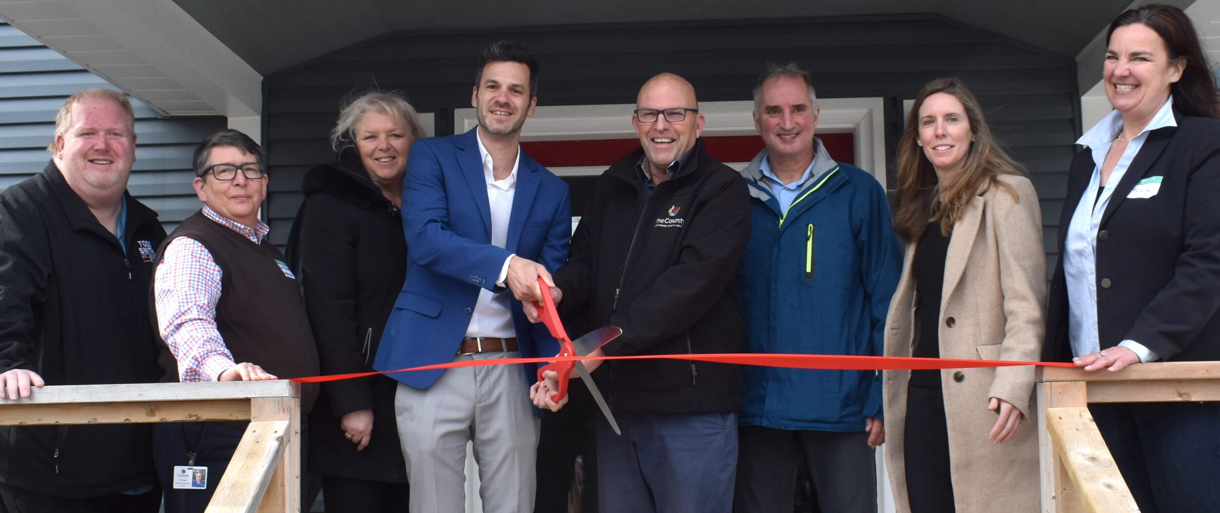 <p>Helping cut the ceremonial ribbon at Leeward House were (From Left) Adam Bramburger on behalf of MPP Todd Smith, Affordable Housing Supervisor Ellis Ziegler, PELASS Director Lynn Chenier,  Base31 Chief Placemaking Officer Assaf Weisz, Mayor Steve Ferguson, PELASS Manager Scott Robertson, Rockport Group’s Vice President of Development & Planning Kathryn Randall, and Leeward Transitional Housing Coordinator Tricia Richens. (Jason Parks/Gazette Staff)</p>
